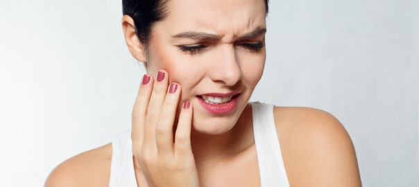 health people Dental and lifestyle concept - Teeth Problem. Woman Feeling Tooth Pain. Closeup Of Beautiful Sad Girl Suffering From Strong Tooth Pain. Attractive Female Feeling Painful Toothache