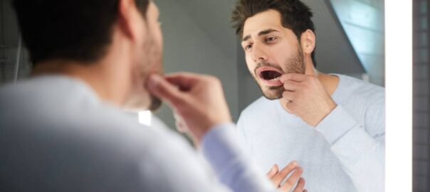 man checking wondering what does a cavity look like