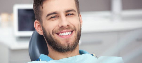 smiling man in dentist's chair