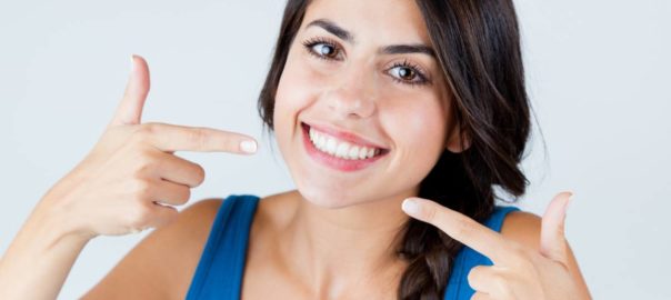 Woman smiling without side effects of teeth whitening